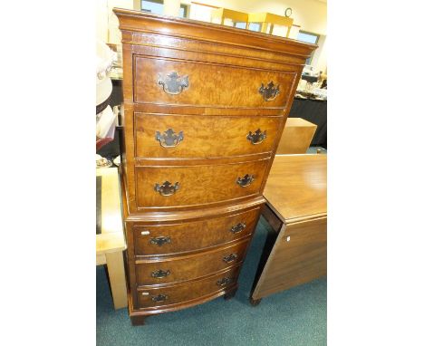 A Reprodux Bevan Funnell Ltd figured walnut bow front chest on chest of six graduated drawers on bracket feet, 55cm wide, 40c