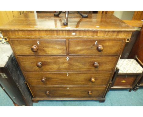 A George IV mahogany and chevron strung chest of two short and three long graduated cockbeaded drawers between faux fluted, c