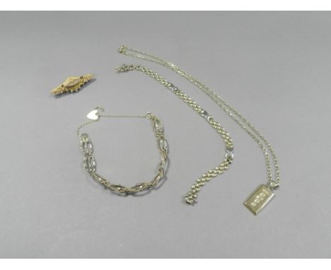 A 9ct gold ingot pendant on chain together with a yellow metal three bar gate link bracelet, a 9ct gold brick link bracelet a
