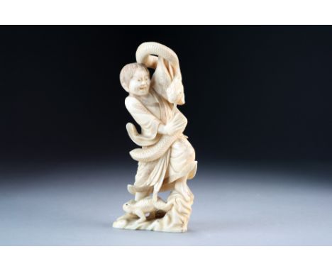 A Japanese ivory okimono of Gama Sennin, Meiji period, modelled standing on a rocky base, his pet toad at his feet as he grap