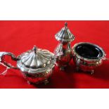 A Barker Ellis, silver plated on copper three piece condiment set, comprising salt, pepper and lidde