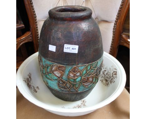 A large vintage ceramic bowl with a papier Mache pot