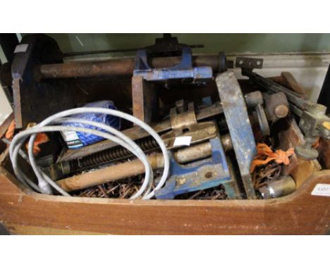 A wooden box containing an assortment of tools