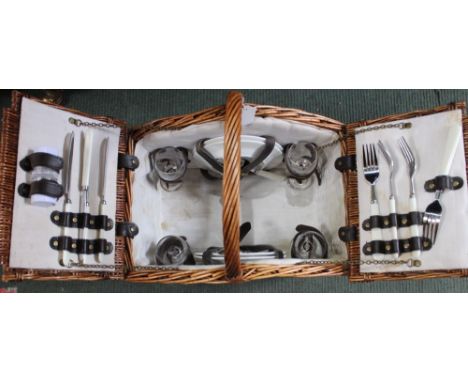 A vintage wicker hamper for four people, complete with contents, basket having carrying handle & leather strap-work