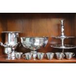 A silver plated champagne urn cooler and other plated wares including a fancy punch bowl and six cup