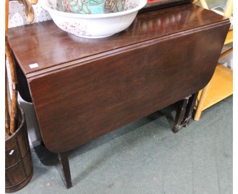A mahogany twin flap gate leg table
