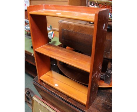 A modern three tier wall hanging shelf unit