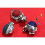 Three silver pin cushions, on in the form of a chick, others an elephant and a turtle (3)