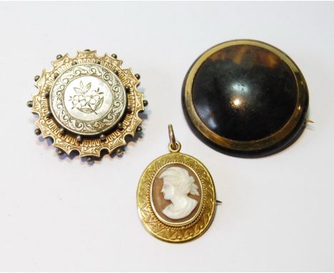 Victorian silver and gold circular brooch, another, with gold band on tortoiseshell, and a Victorian cameo brooch/pendant, in