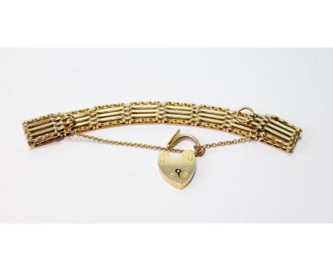Edwardian gold gate bracelet, 10mm wide, with padlock, '9ct', and spare link, 13.9g. 