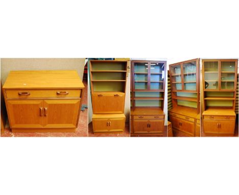 G Plan 1960s teak modular display unit comprising three matching cabinets, each with two glazed doors above open shelf, on lo