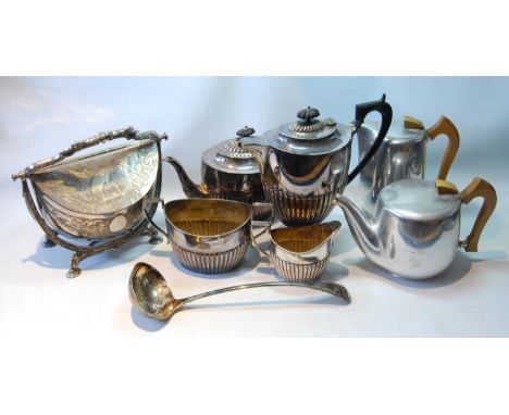 Victorian EP biscuits container, ovoid, with chased storks and sprays and a gilt interior, also a part fluted four-piece tea 