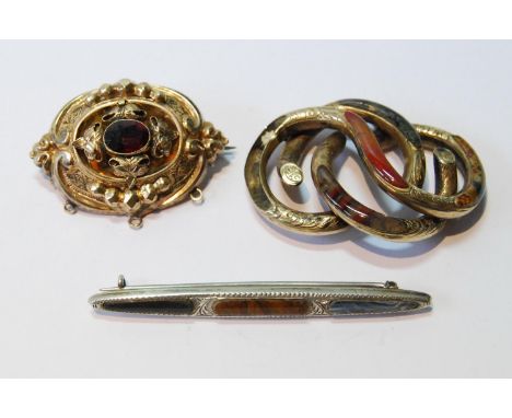 Victorian gold and garnet brooch, another with 'Scotch pebbles', and a similar silver brooch. 