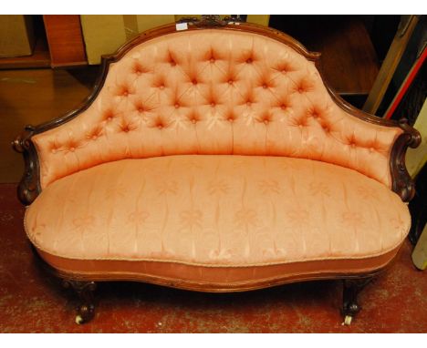 Late Victorian rosewood and walnut button-back parlour sofa upholstered in later pink fabric, scroll frame, on shaped support