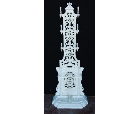 Gothic inspired painted cast iron hall stand with a pierced scroll and fern frame with six pegs above stick stand recess and 