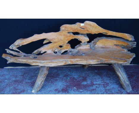 Rustic burr and yew wood bench of naturalistic form, in the manner of Reynolds of Ludlow, on tripod supports, approximately 9