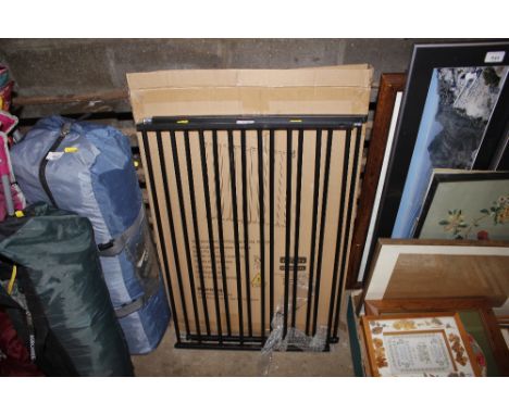 An extending metal pet gate