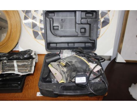 A McKeller orbital sander in fitted case 