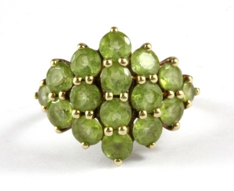 A 9ct yellow gold peridot set large cluster ring, (L.5).