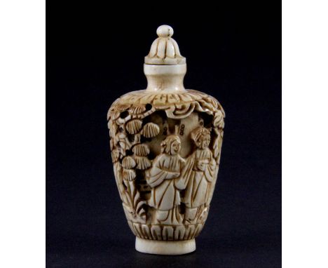 A Chinese carved mammoth ivory snuff bottle, H. 7.5cm.