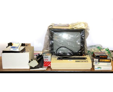 A vintage Amstrad cpc6128 computer with games, printer, keyboard, etc.