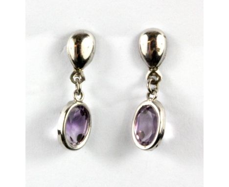A pair of 9ct white gold amethyst set drop earrings, L. 2cm.