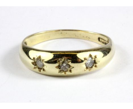 A 9ct yellow gold diamond set gipsy ring, (M.5).