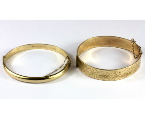 A 9ct yellow gold bangle together with a 9ct rolled gold bangle.