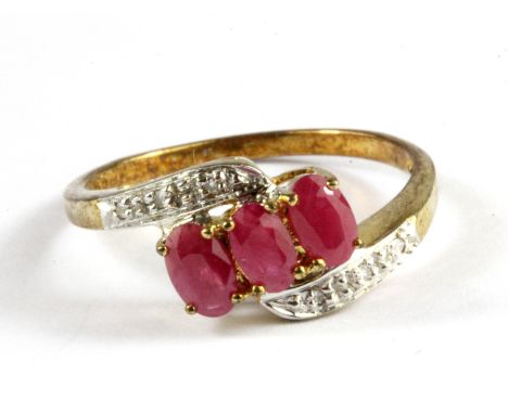 A 9ct yellow gold ruby and diamond set ring, (N.5).