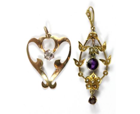 An Edwardian 9ct yellow gold stone set pendant and a further 14ct gold (stamped 14k) amethyst and seed pearl set pendant, L. 