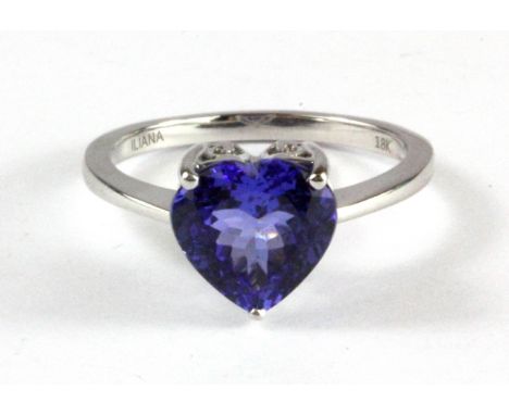 An 18ct white gold (stamped 750) heart cut tanzanite set ring, (R).