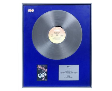 Judas Priest/K. K. Downing: A 'Silver' sales award for the album British Steel,1980,presented to K. K. Downing for sales in t