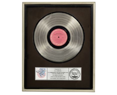 Judas Priest/K. K. Downing: A 'Platinum' sales award for the album Screaming For Vengeance,1983,presented to K. K. Downing fo