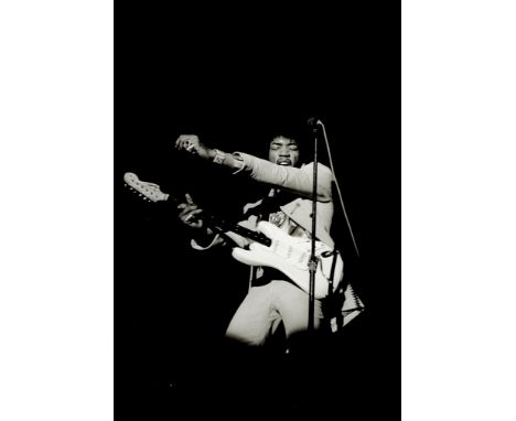Linda McCartney (American, b.1941-d.1998): Jimi Hendrix playing guitar in New York, 1967,printed 1990,a silver gelatin black 