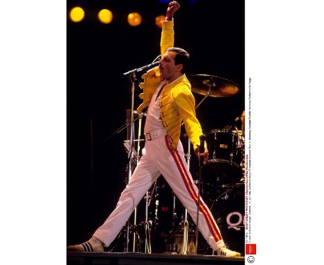 Queen: A pair of Freddie Mercury's trousers, as worn for the final tour,1986,white cotton, with gold-coloured belt buckle and