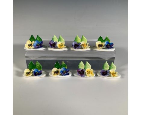A lovely eight-piece set of hand crafted fine bone china place card holders, exquisitely adorned with yellow and purple flowe