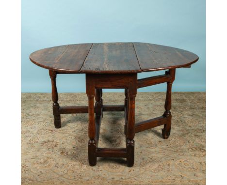 Fantastic gate leg oval table with a small drawer at one end. Perfect side table when the drop leaves are down or a dining ta