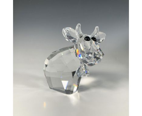 A large faceted figure of a sweet cow with a bell around her neck, adorned with Jet Hematite crystal eyes. Swarovski marking.