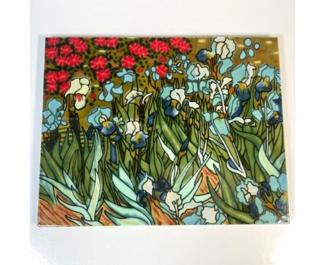 Hand painted flower garden scene on a hanging ceramic tile. Rich blues and greens dominate the foreground with red bursts in 