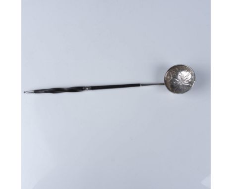 An elegant 19th-century silverplated ladle featuring a hand-hammered, floral-embossed silver bowl and a finely carved ebony h