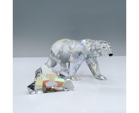 A 2011 annual edition of an Artic bear in moonlight colored crystal with black crystal eyes and nose. Includes an iceberg for