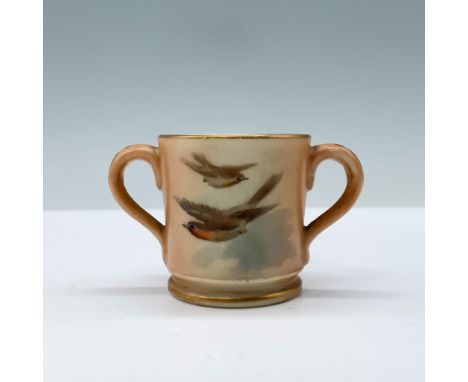 Hand painted footed miniature cup featuring two handles and adorned with vibrant orange and yellow birds set against a sky ba