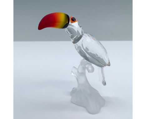 This crystal toucan was made from clear crystal and sits on a frosted branch. His beak is made from fire opal crystal. Part o