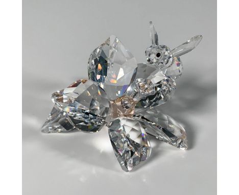 This stunning clear faceted figure features a small bee perched on a beautiful flower with a light peach crystal stamen. It w