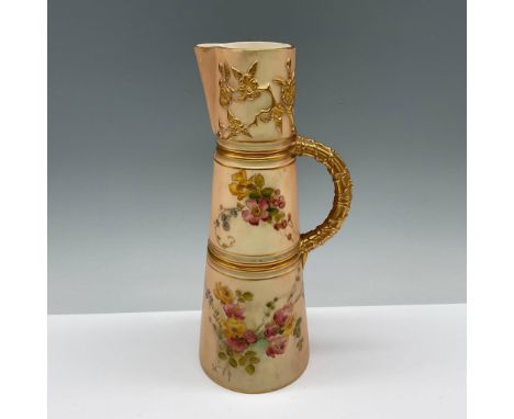 A biscuit ground pitcher with hand painted floral sprays, and gilt handle and trims. Royal Worcester backstamp. Marked RdNo 1