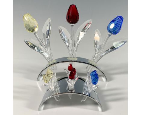 This colorful crystal collection features three large tulips on a stand, along with a second stand holding nine miniature tul