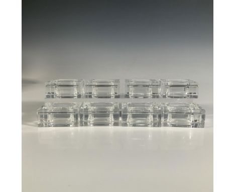 An exquisite set of eight clear Lucite napkin holders featuring a sleek, modern design with a smooth rectangular frame and ov