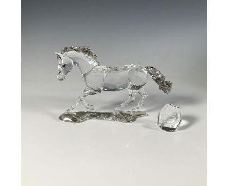 This dazzling faceted figure, inspired by the wild Criollo horses of South America, features a horse with a clear body and li