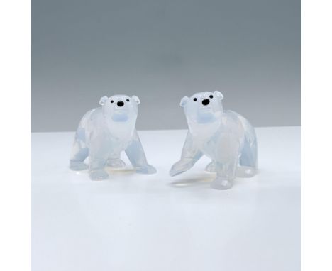 A beautiful Swarovski Crystal Society set of polar bear cubs made from white opal crystal with jet eyes and noses. Swarovski 