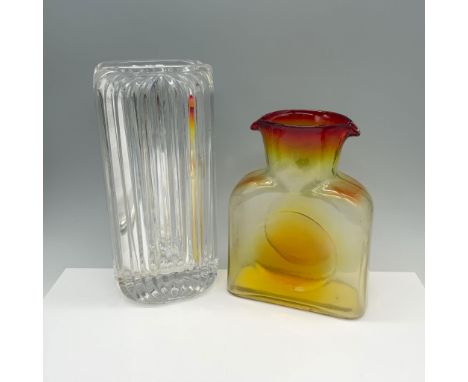 Ravishing duo of glassware that includes a Blenko tangerine water bottle and a Villeroy and Boch tall flower vessel. Largest 